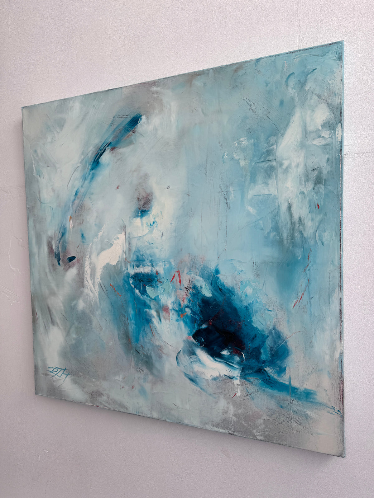 Side view of Fire and Ice abstract painting showing deep edge canvas profile in studio, 30x30 oil painting by Roberta Heslop