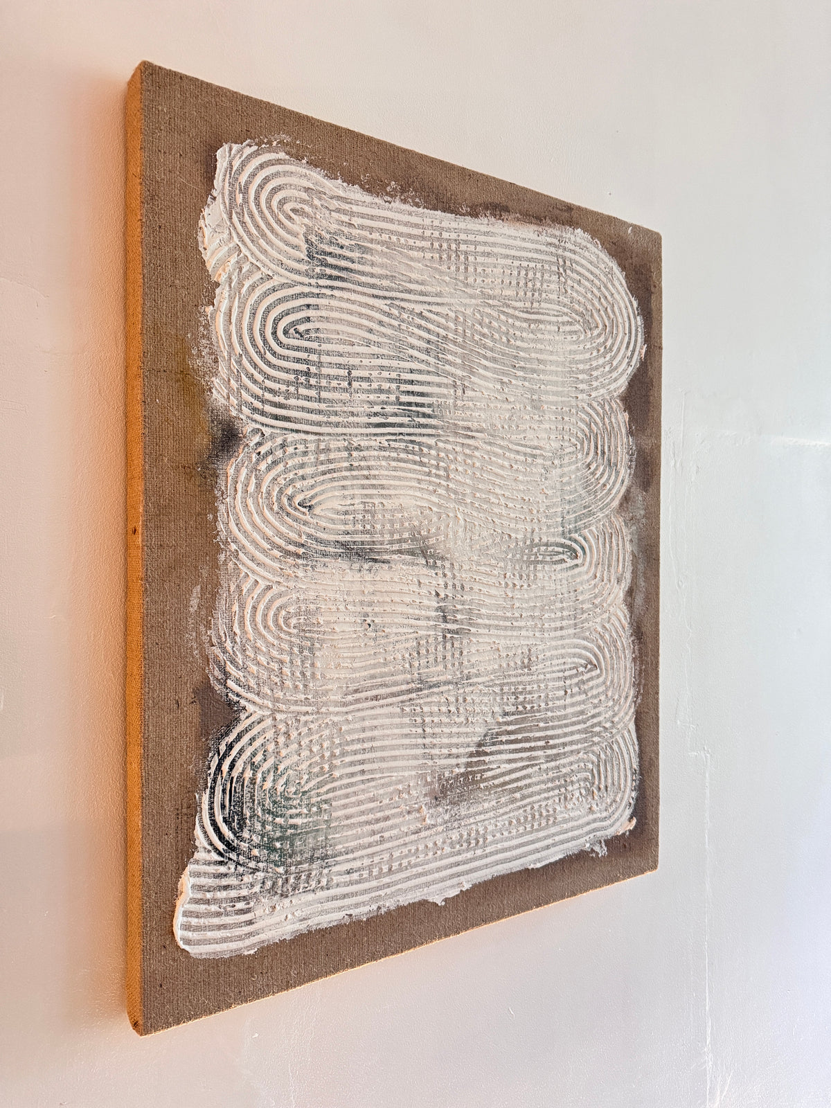 Detail of textured surface and earth tones in Echoes Within original artwork