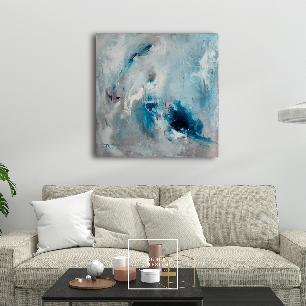 Fire and Ice abstract blue painting by Roberta Heslop displayed in modern living room, 30x30 oil on canvas