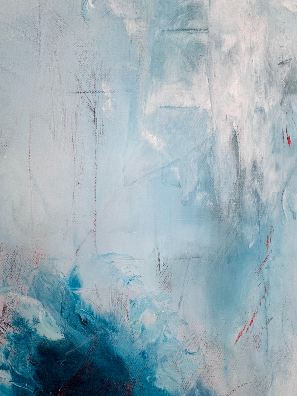Detail view of Fire and Ice abstract painting revealing textured, layered blues and warm undertones in oil paint