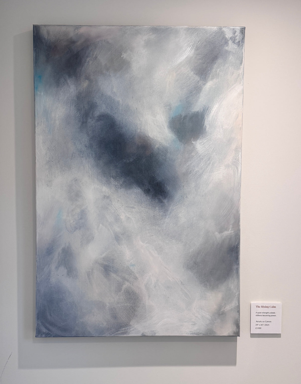 Ethereal abstract painting The Quiet Between hanging in gallery exhibition white space