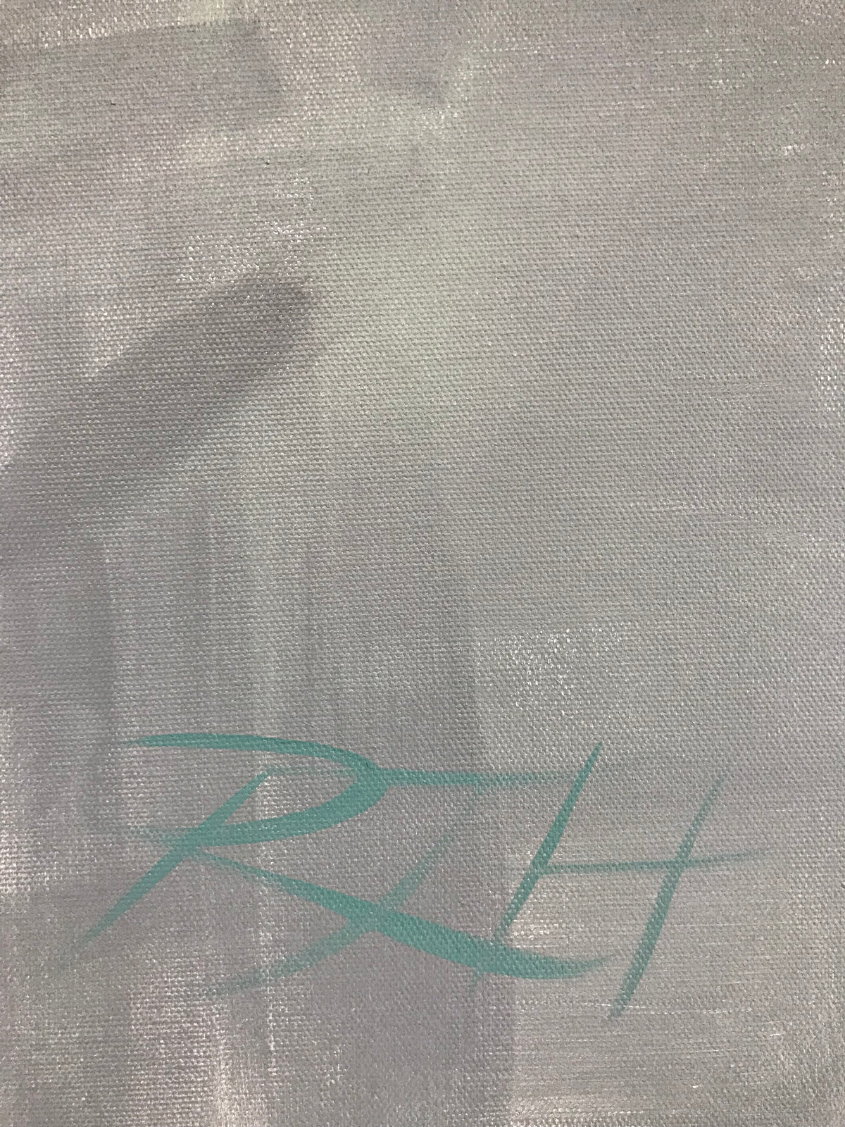 Close-up of Roberta Heslop’s signature on the painting Auburn Beauty, showing fine brush detail and texture of the canvas.
