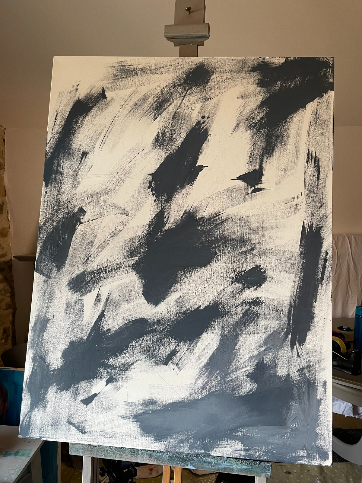Early stage of Silent Eloquence — expressive, fluid brushwork on canvas in soft and dark grey tones